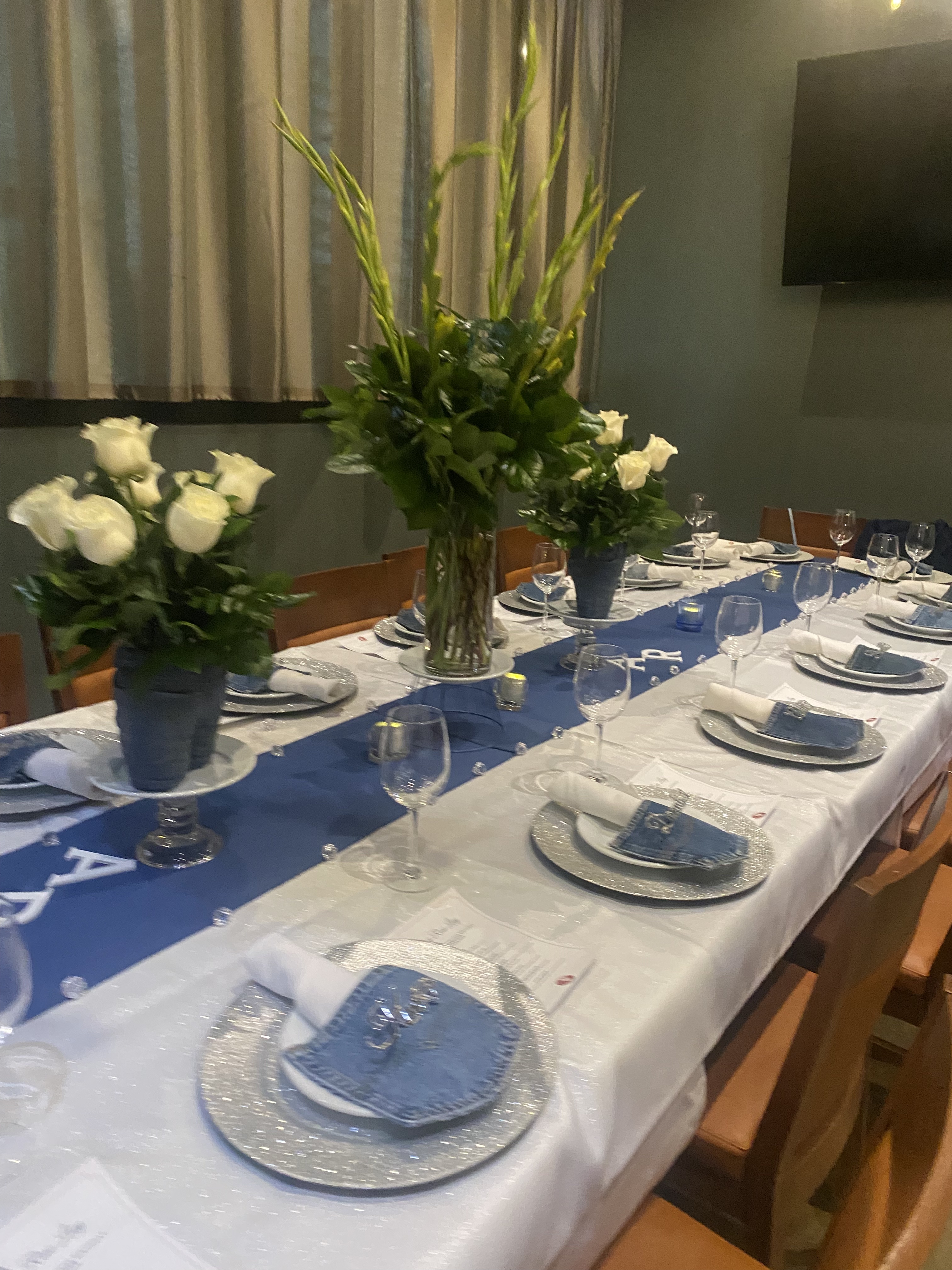 Denim and Diamonds tablescape with white roses and blue runner